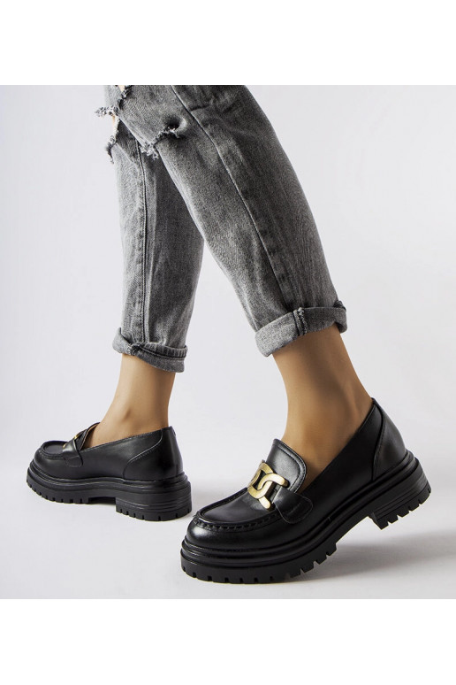 Schwarze Loafer verziert mit einer...