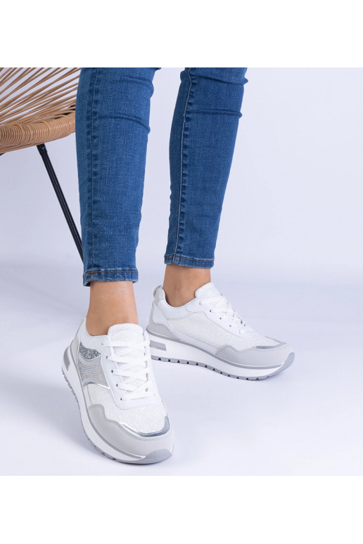 Witte sneakers versierd met glitter...